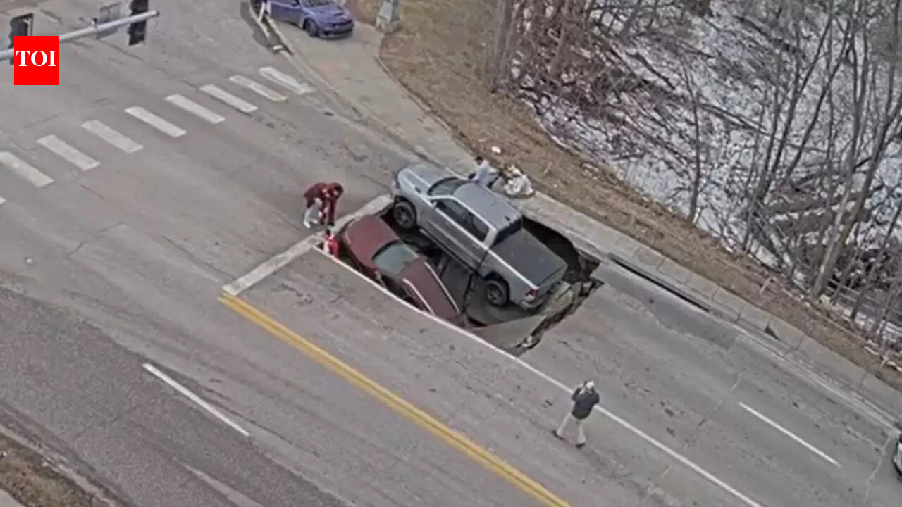 Watch: Massive sinkhole opens up on Nebraska road, swallows two vehicles; leaves bystanders stunned