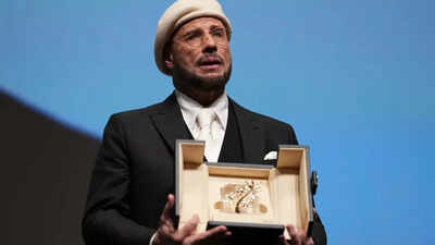 John Travolta tears up over honorary Palme d’Or at Cannes Film Festival; makes directorial debut with ‘Propeller One-Way Night Coach’