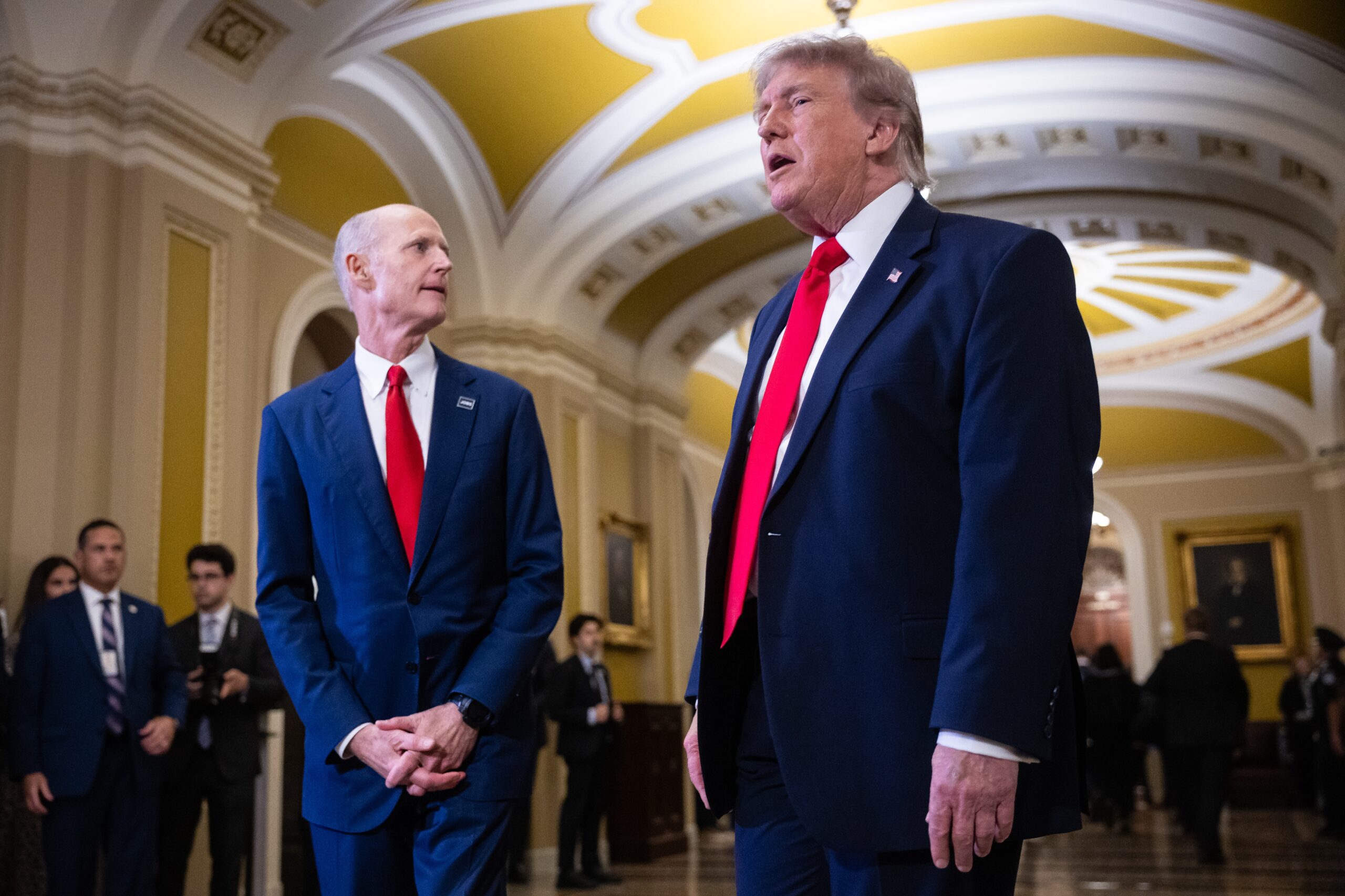 Rick Scott says he’s just trying to help