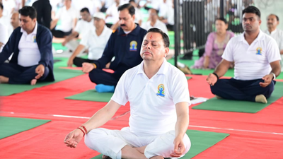 Uttarakhand CM Pushkar Singh Dhami joins Yoga Day celebrations in Banbasa | India News