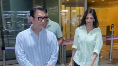 Aamir Khan returns to Mumbai with wife Gauri Spratt; stepson left puzzled by paparazzi rush – Video |