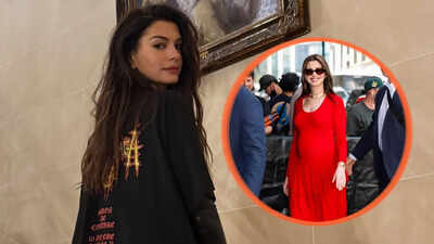 Anne Hathaway Hilariously Reacts to Wearing Maternity Jumpsuit Backwards |