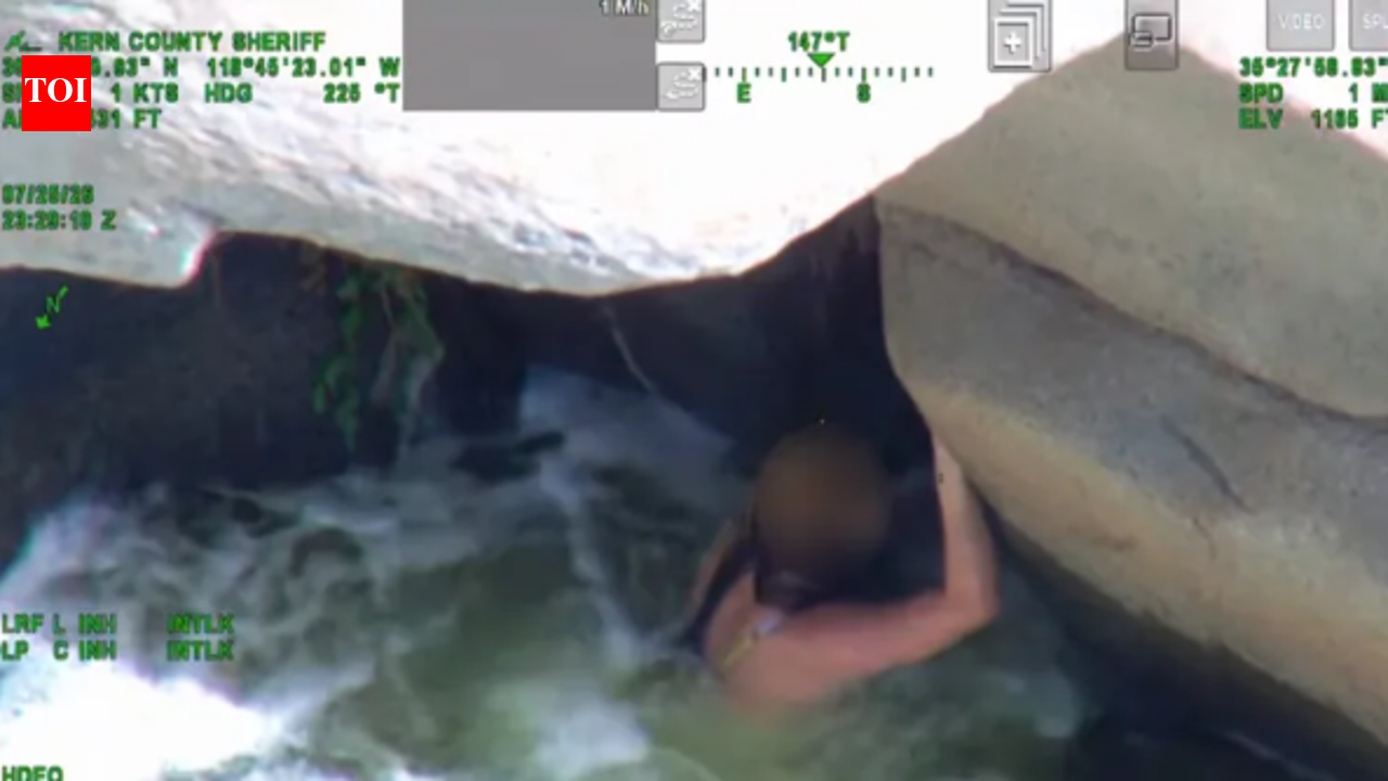 California woman was swept down the Kern River and found clinging beneath a rock; rescuers pulled her from the rapids
