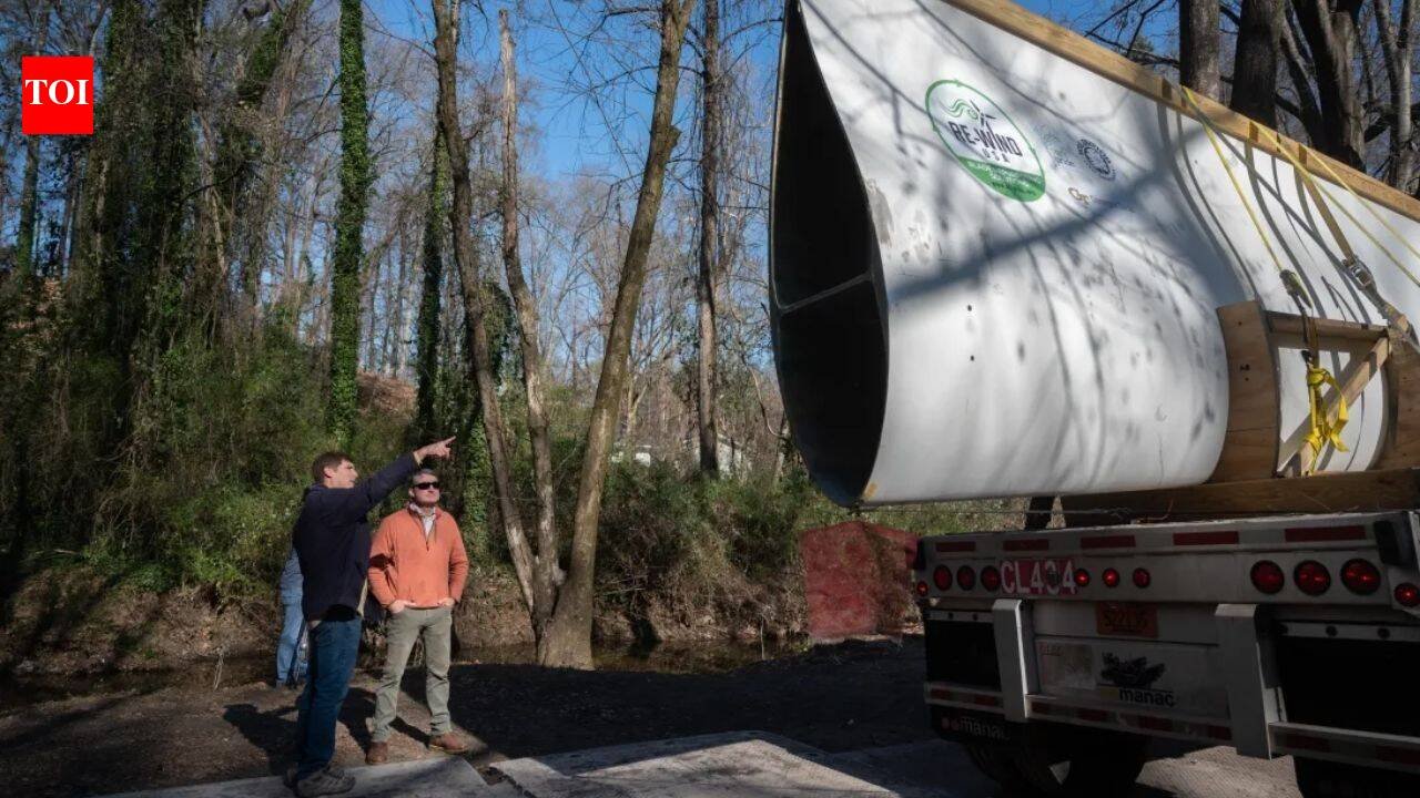 Atlanta reused a nearly 7,000-pound wind turbine blade as a 50-foot pedestrian bridge; the retired Colorado blade now carries walkers through Beaverbrook Park
