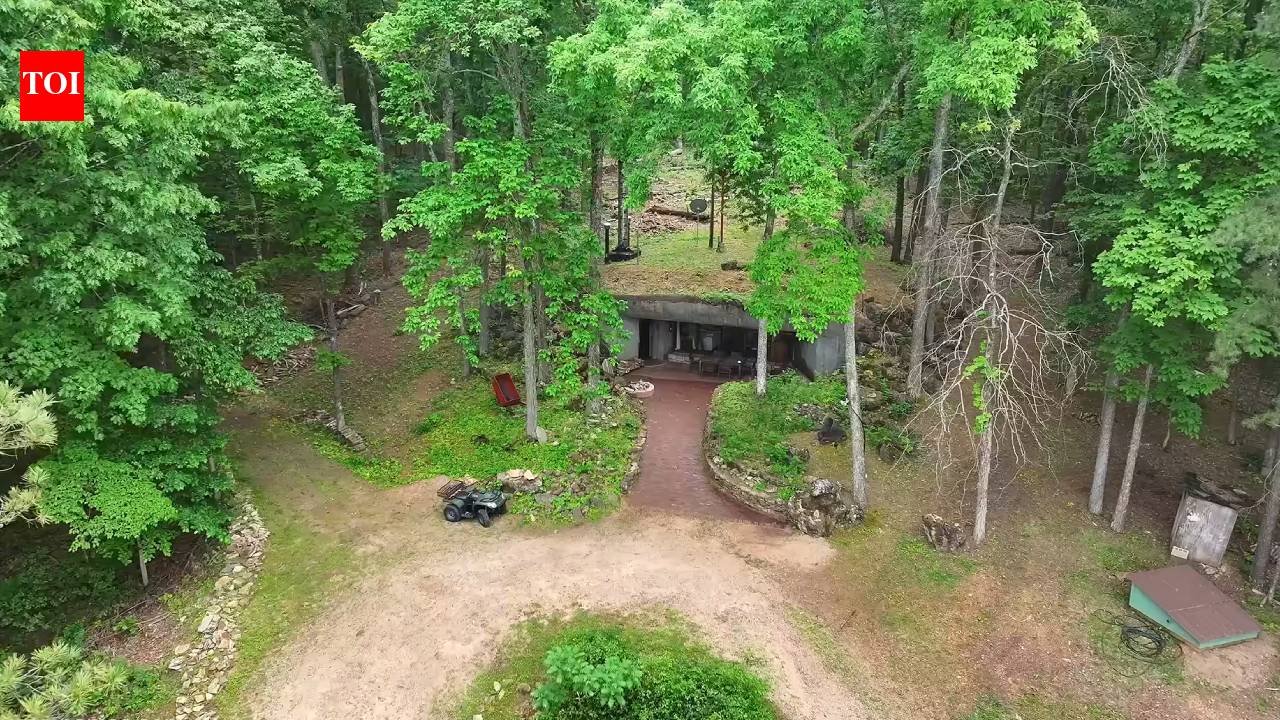 A Missouri engineer bought remote Ozarks land in 1970 and slowly built a reinforced-concrete home into the hillside; more than 50 years later, his son is restoring it room by room