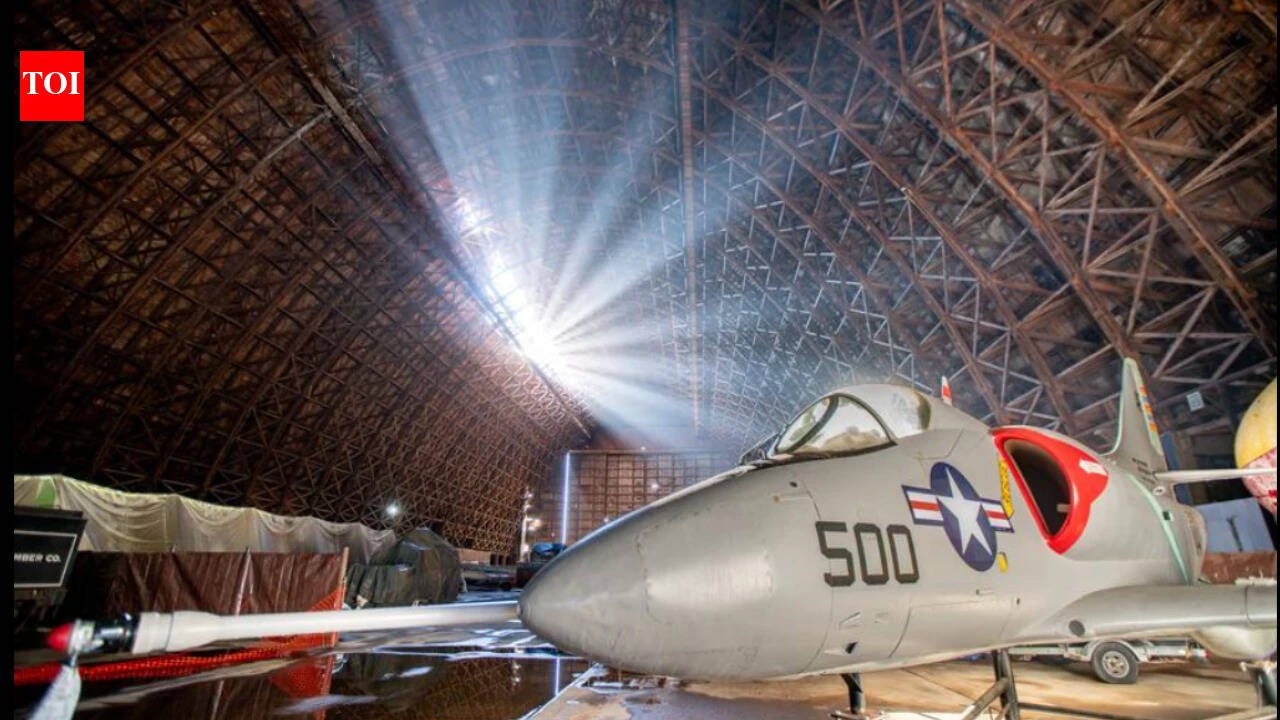 An 83-year-old Oregon blimp hangar was sold for $1 after a storm tore a 200-foot hole in its roof; after nearly 10 months shut, the air museum inside is now set to reopen on October 29
