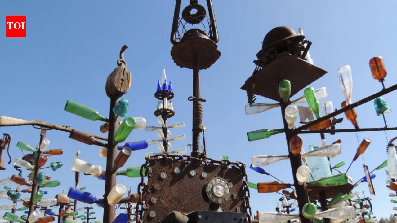 California cement worker Elmer Long turned discarded bottles and scrap metal into a desert art forest; as Route 66 turns 100, his two-acre ranch has 200 trees, 1,000+ bottles and visitors from around the world